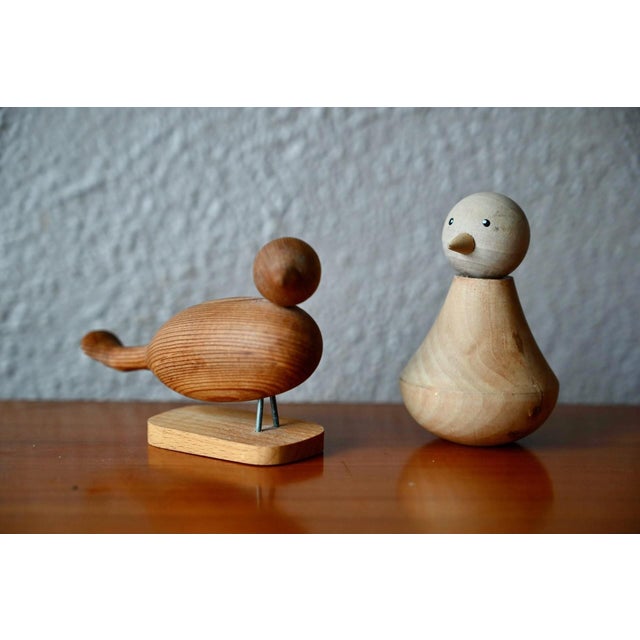 “No bird soars too high if it soars on its own wings.” — William Blake This charming pair of minimalist turned wood birds...