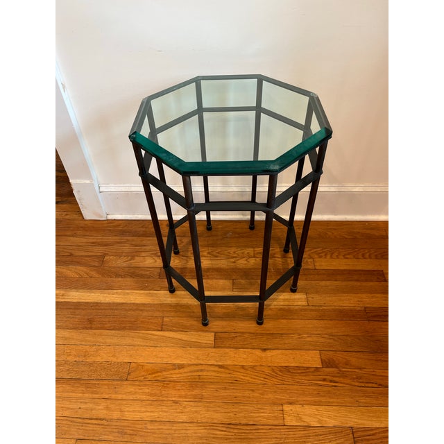 Striking vintage American octagonal side table featuring a substantial patinated bronze frame and a thick, green-tinted...