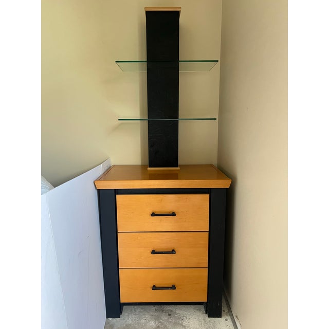 Vintage contemporary wooden nightstand (or pier unit) featuring a distinctive vertical display tower equipped with two...