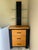 Vintage contemporary wooden nightstand (or pier unit) featuring a distinctive vertical display tower equipped with two...