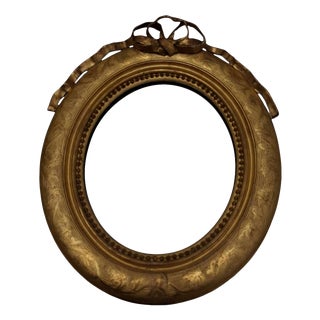 Oval Giltwood Wall Mirror with Crest, Late 19th Century For Sale