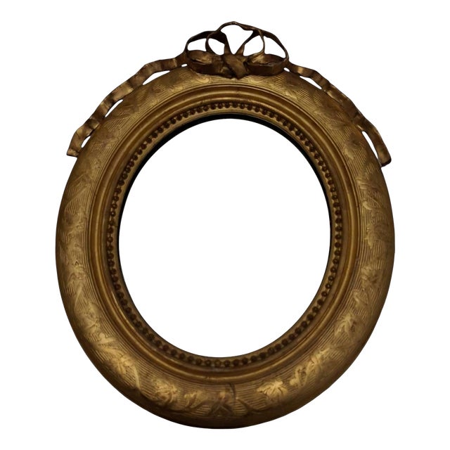 Oval Giltwood Wall Mirror with Crest, Late 19th Century For Sale