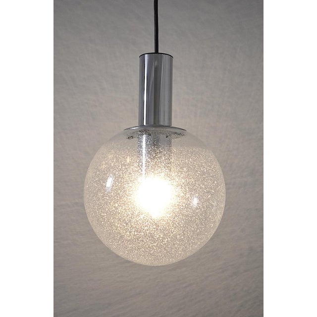 Glass ball pendant lamp from the Limburg company from the 1960s. - Clear glass ball in foam glass technology - Very...