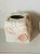 Vintage ceramic tissue box cover decorated with sea shell decor.