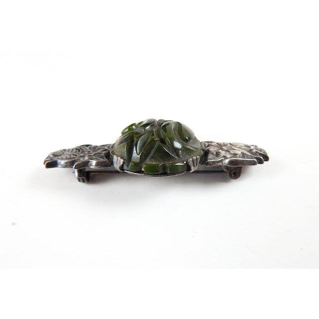 Vintage circa 1940's carved green bakelite and silver plate pin or brooch. Carved floral round bakelite cabochon prong set...