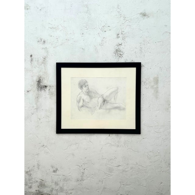 A Vintage Boho Graphite on Paper Figure Drawing of a Man would feature a figure in a natural, expressive pose, drawn with...