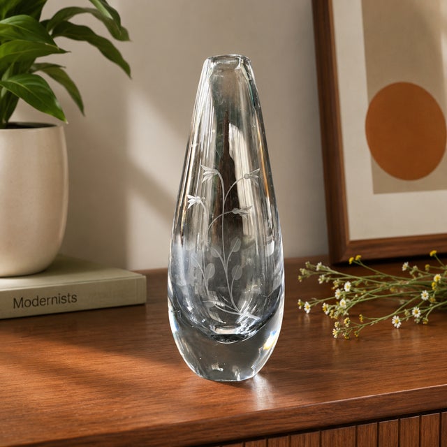 A signed vintage Kosta Sweden crystal bud vase, model H3053, handcrafted in Sweden circa the 1960s. This elegant...