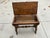 This "slipper bench" from the 1950’s has storage under the seat for slippers. The bench is solid wood with carvings on...