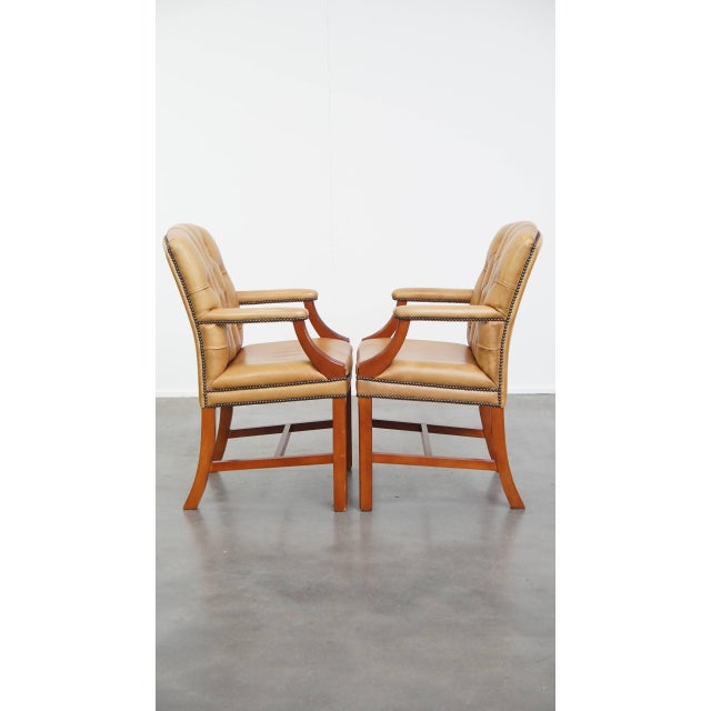 This magnificent set of two Chesterfield chairs exudes luxury and stateliness. These chairs are made of cowhide. They are...