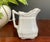 Charming antique Royal Ironstone pitcher by H. Alcock & Co of England. This small creamer/ pitcher is crafted in creamy...