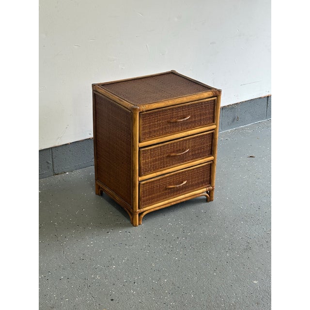 A versatile small three drawer chest / nightstand in the British colonial style. Compromised of bamboo skeleton and cane...