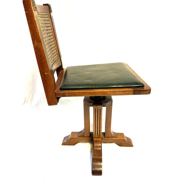 W.D. Allison Co. of Indianapolis. Physicians swivel examination chair with oilcloth seat, original caned backrest and...