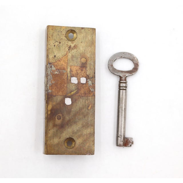 Reclaimed cabinet door mortise lock made of brass with a key. These locks were commonly used for cupboards or furniture...