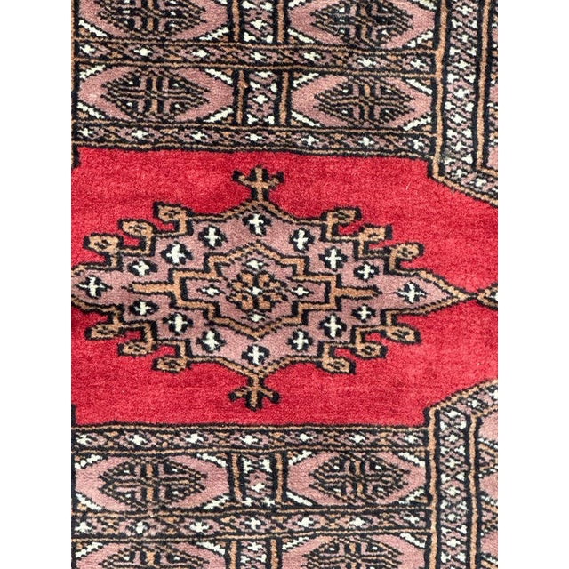 Beautiful vintage Pakistani rug with a design of the Turkmen rugs and nice colours with red , pink grey yellow white and...