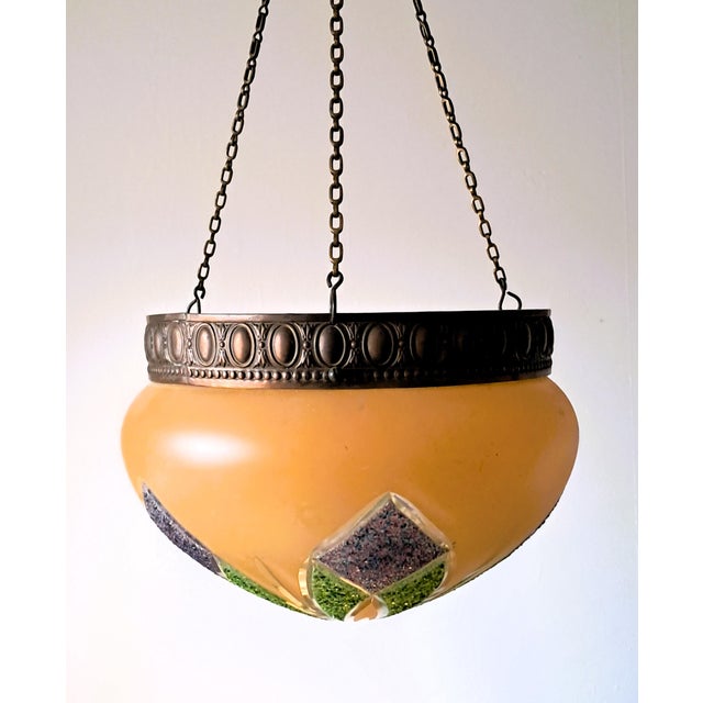 Decoration object, used to hang plants from the ceiling. The inner basket for plants is no longer present.