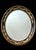 Elegant eye catching Regency style oval bevelled wall mirror by prestigious Friedman Brothers Decorative Arts Inc....