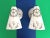 Fresh and fun pair of 1960s coastal style wall sconces of molded creamy white resin painted with central matte gold ships...
