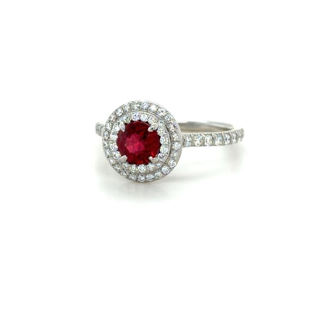 This beautifully classic ring by Tiffany & Co. from their Soleste collection, boasts a beautiful round brilliant cut ruby...