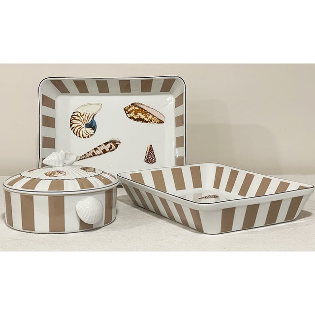 These are three fine bone china casserole dishes by Shafford, which is based in Japan. The outer border is alternating...