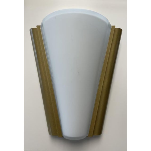 These beautiful 1990s vintage pieces feature a classic, subtly Art Deco-inspired curved design. The frame is crafted from...