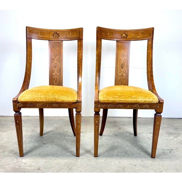 An elegant pair of antique inlaid European side chairs of mahogany and satinwood with goldenrod velvet / velour...