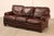 High Quality American Made Leather Three-Seat Sofa with Rolled Arms and Brass Tack Trim, Mounted on Bun Feet