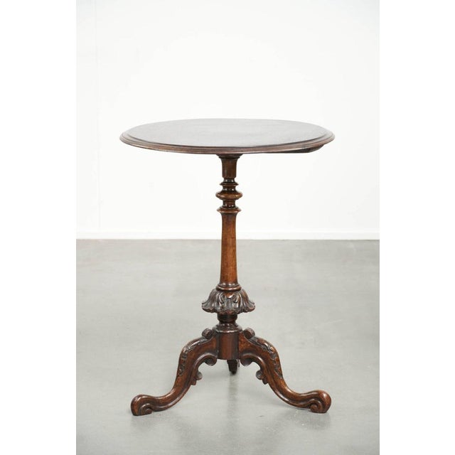 Round antique, elegant, and charming side table/wine table with beautiful colors and rich carving. : This round antique...