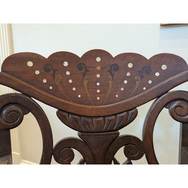 A striking vintage Edwardian-style carved wood armchair with the kind of presence that instantly gives a room character....