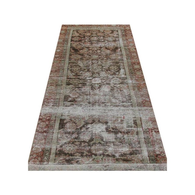 Enhance your hallway with a 3x9 Handwoven Vintage Persian Runner from Iran. Crafted with intricate patterns, it brings...