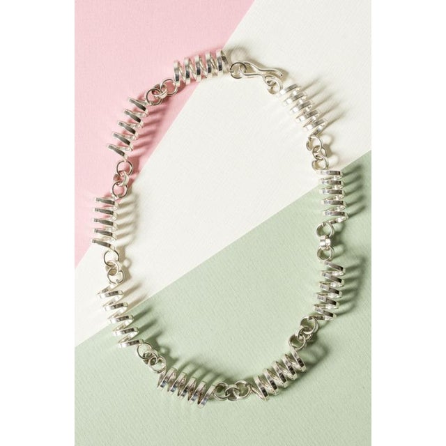 Amazing silver collier by Cecilia Johansson, in a vivacious, bouncy spiral design. Weighty quality and beautiful...