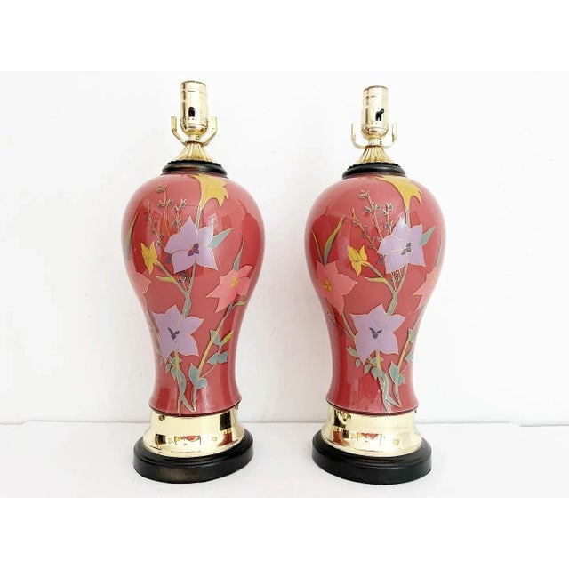 Stunning pair of vintage 1970s cased glass vase lamps in a rich burgundy with colorful hand painted climbing florals and...