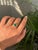 This solitaire bezel set ring featuring a 1.64 carats natural oval-cut emerald set in 18K yellow gold. The emerald...