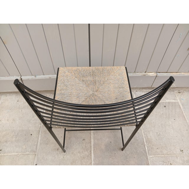 Set of 4 Alice chairs, Cidue, woven straw seat and iron frame. This piece has an attribution mark, I am sure that it is...