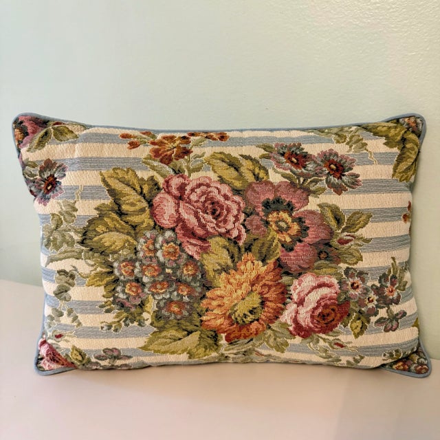 Woven floral design in vintage -style color palette: on a background in light blue and ivory stripes. Reverse side is a...