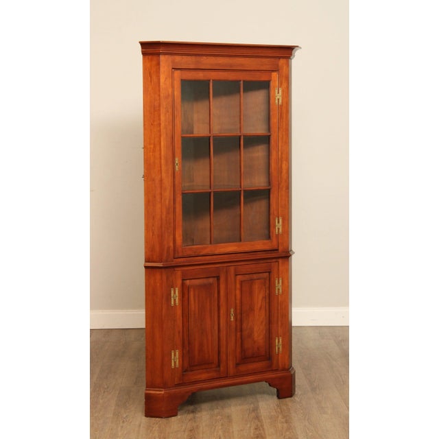 High Quality American Made Solid Black Cherry Corner Cupboard with Glazed Door Opening to Lighted Bookcase Interior Over...