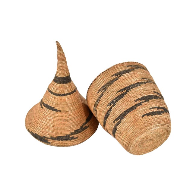 The Tutsi Tight Weave Basket with Lid from Rwanda epitomizes the artistry and tradition of the Tutsi community's weaving...