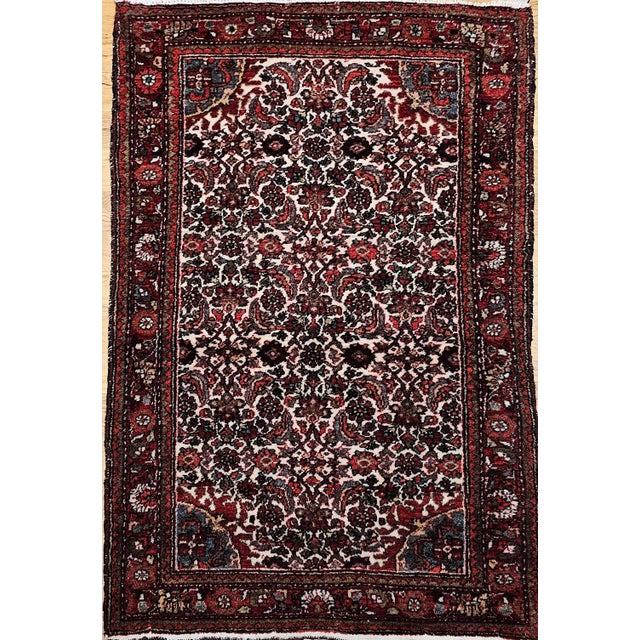 An exceptional mid-20th century Persian Malayer rug hand-knotted with an elegant allover Herati geometric pattern on a...