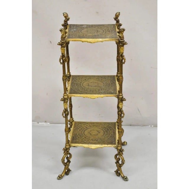 Antique Victorian Cast Iron Figural Renaissance 3 Tier Plant Stand Side Table. Circa 19th Century. Measurements: 31" H x...
