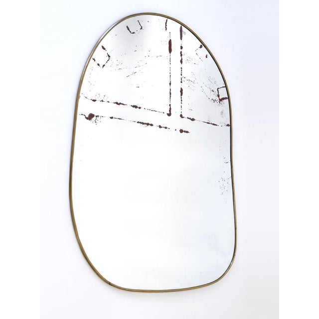 Gorgeous, large and highly decorative Mid Century Modern asymmetric wall-mounted mirror. Manufactured in Germany, 1950s....