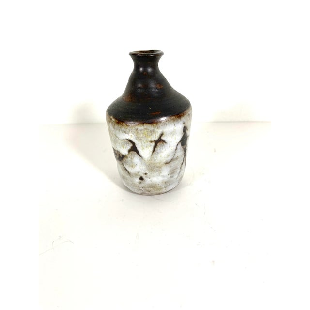 Width: 2.5 inches Height: 4.5 inches Small brown and white stoneware studio pottery bud vase with hieroglyphics. Handmade,...