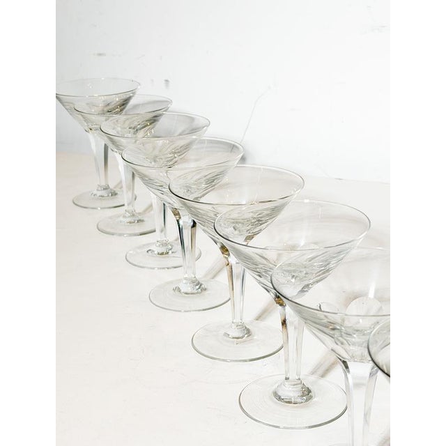Elegant set of eight champagne coupes crafted in clear crystal by Val Saint Lambert, one of Belgium’s most renowned...