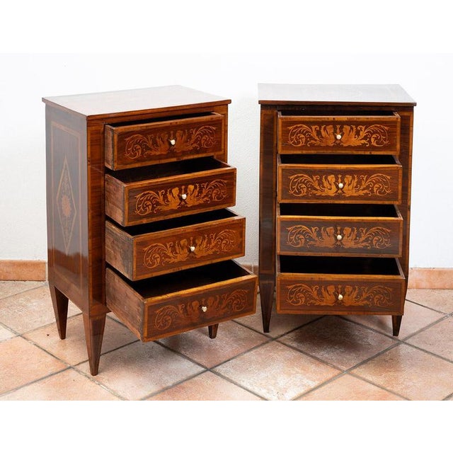 A pair of antique Louis XVI-style nightstands made of polychrome wood, of Lombard origin, dating from the 19th century....