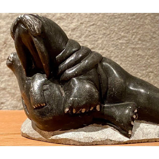 Wonderfully smooth and expressive vintage soapstone carving of two seals by Jimmy Inaruli Arnamissak (1946-2003) of the...