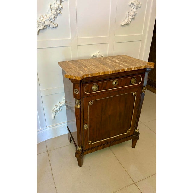 Antique 19th century French figured mahogany marble top side cabinet having a superior marble top above a single figured...