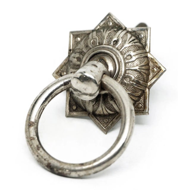 Antique Colonial style ring drawer pull made of brass with a nickel finish. Good condition with surface wear from prior...