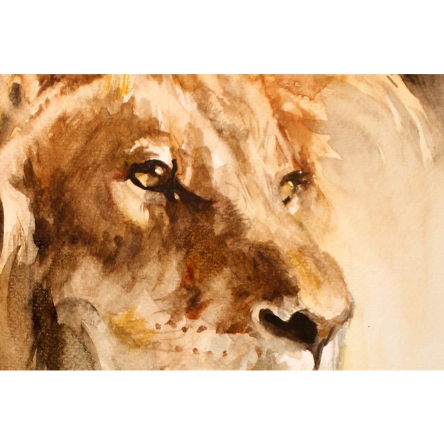 This watercolor depiction of a lion captures the majestic creature with a striking focus on its expressive face and...