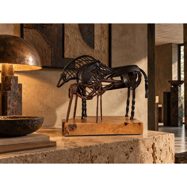 Striking vintage Brutalist-style sculpture featuring an abstract mare and foal crafted from metal. The open-form design is...
