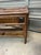 A beautiful palm beach style two-tiered bamboo console with split bamboo detailing and intricate woven rising sun...