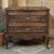 This 19th century Louis XV Country French commode captures the warmth and grace of provincial craftsmanship, rendered in...