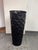 Design Plus Gallery presents a Black Hammered Planter. This planter has a tall, tapered silhouette with an allover faceted...